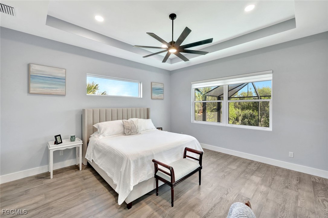 1044 Fish Crow Road Sanibel, FL 33957 - Photo 16 of 36 a bedroom with a bed and a window