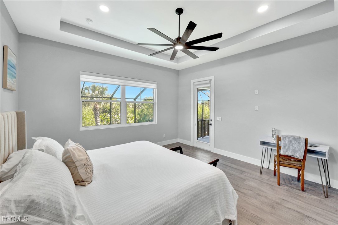 1044 Fish Crow Road Sanibel, FL 33957 - Photo 17 of 36 a bedroom with a bed and a window