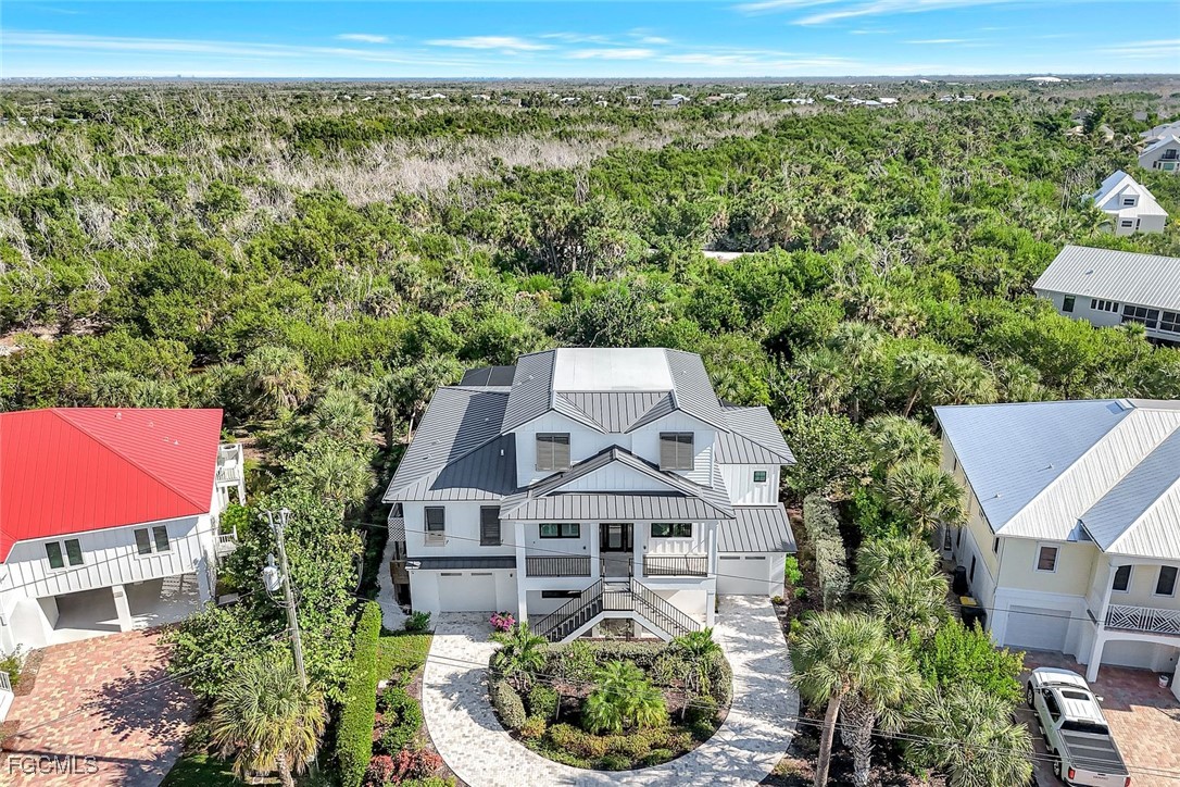 1044 Fish Crow Road Sanibel, FL 33957 - Photo 2 of 36 an aerial view of a house with a yard