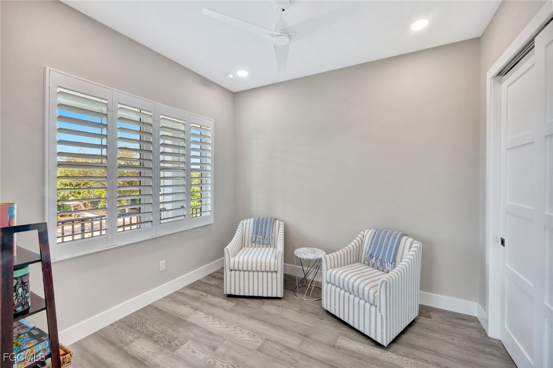 1044 Fish Crow Road Sanibel, FL 33957 - Photo 21 of 36 a living room with furniture and a window