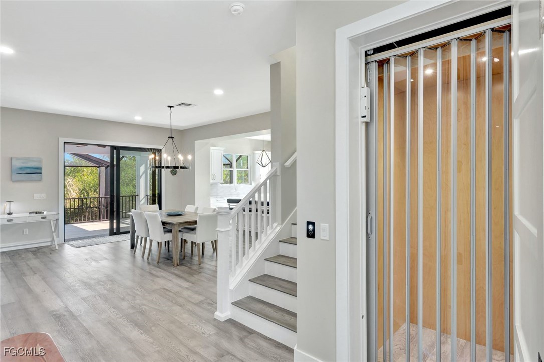 1044 Fish Crow Road Sanibel, FL 33957 - Photo 22 of 36 a view of a dining room with furniture window and wooden floor