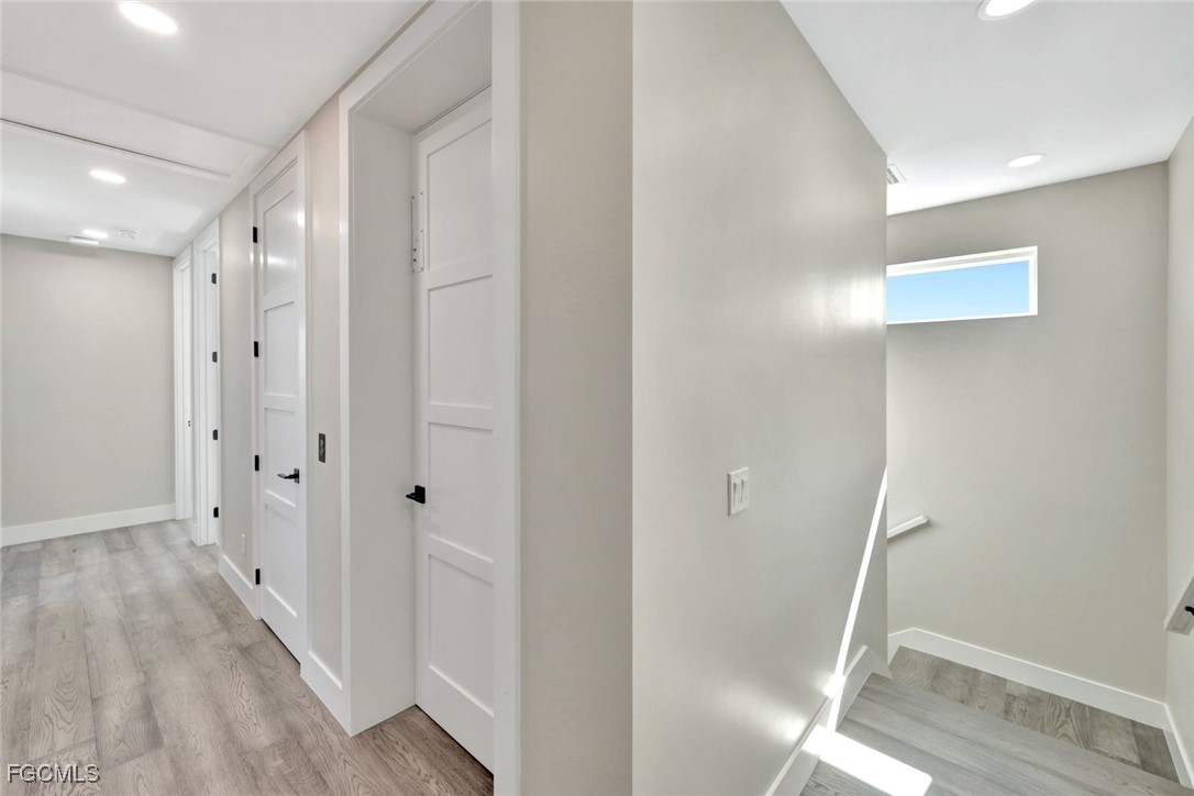 1044 Fish Crow Road Sanibel, FL 33957 - Photo 24 of 36 a view of a hallway with wooden floor