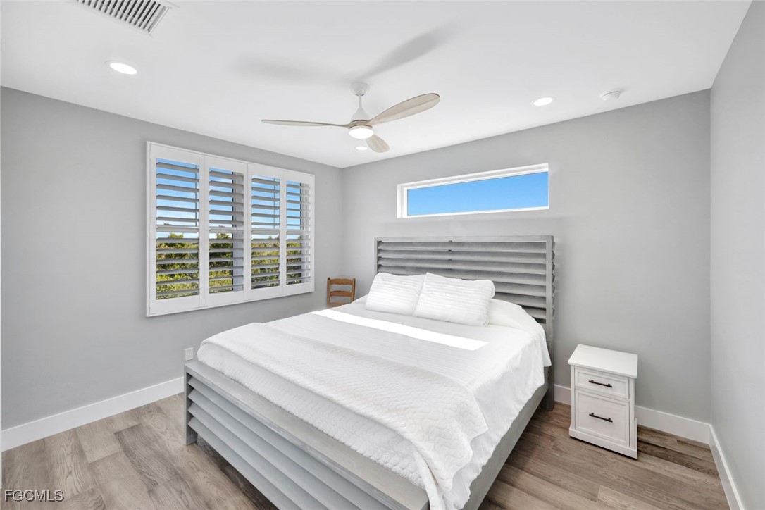 1044 Fish Crow Road Sanibel, FL 33957 - Photo 29 of 36 a bedroom with a bed and a dresser