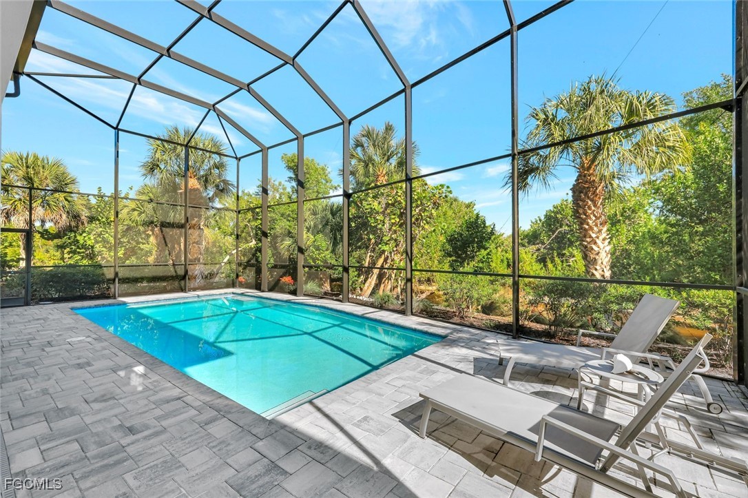 1044 Fish Crow Road Sanibel, FL 33957 - Photo 36 of 36 a view of a swimming pool with a patio