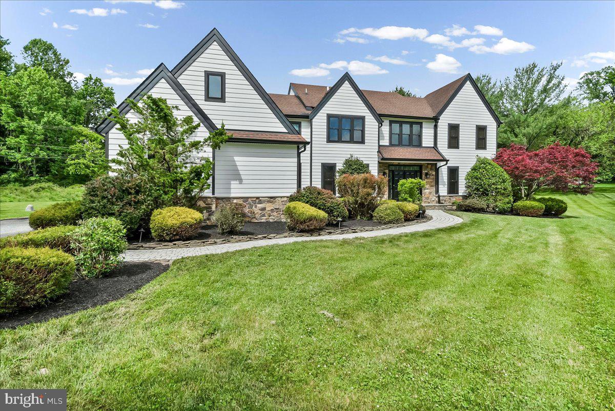 51 Ridings Way Chadds Ford, PA 19317 - Photo 2 of 57 a front view of a house with garden