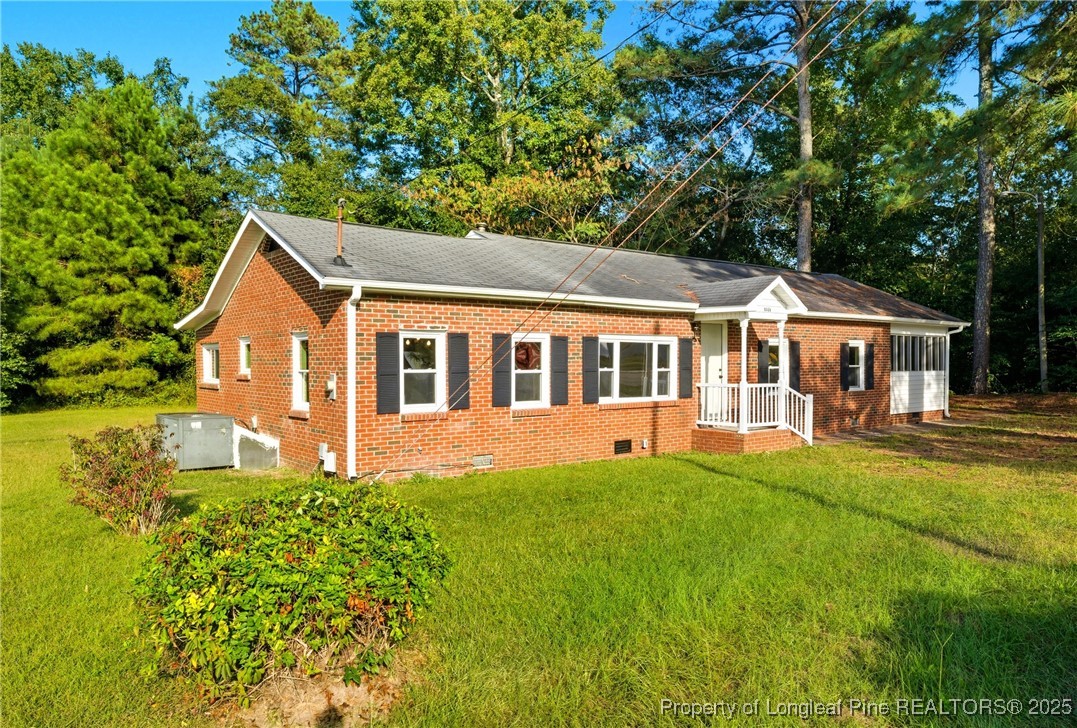 8306 Godwin-Falcon Road Godwin, NC 28344 - Photo 3 of 50 a front view of a house with a yard