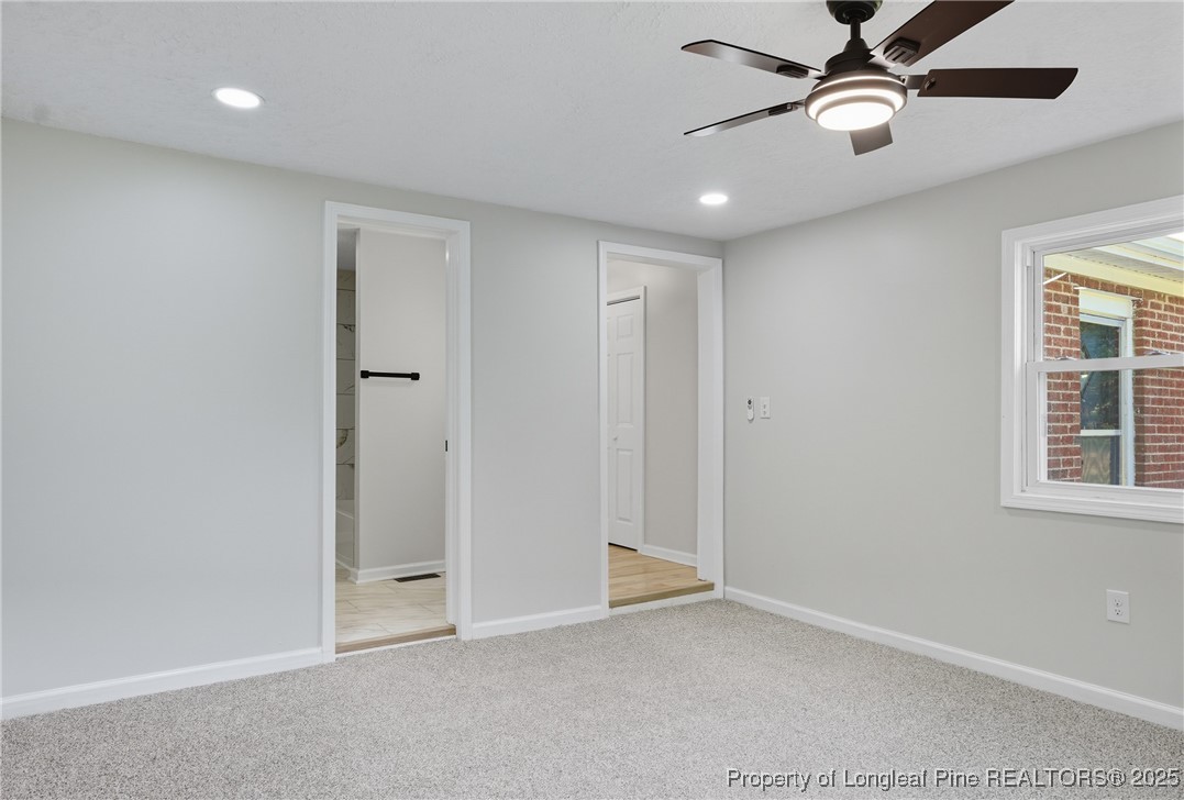 8306 Godwin-Falcon Road Godwin, NC 28344 - Photo 42 of 50 an empty room with windows and fan