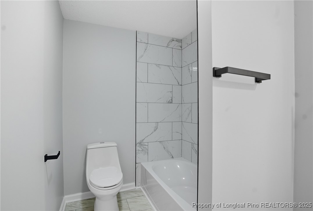 8306 Godwin-Falcon Road Godwin, NC 28344 - Photo 45 of 50 a bathroom with a toilet and shower