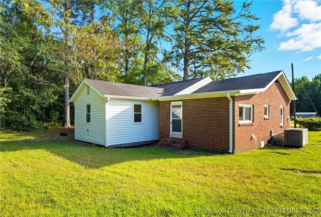 8306 Godwin-Falcon Road Godwin, NC 28344 - Photo 50 of 50 a view of a house with a yard