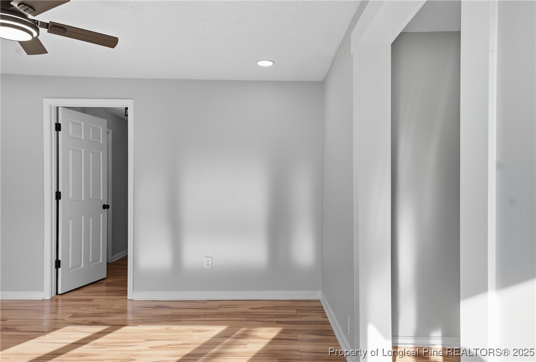 8306 Godwin-Falcon Road Godwin, NC 28344 - Photo 6 of 50 a view of a hallway with wooden floor and a bathroom