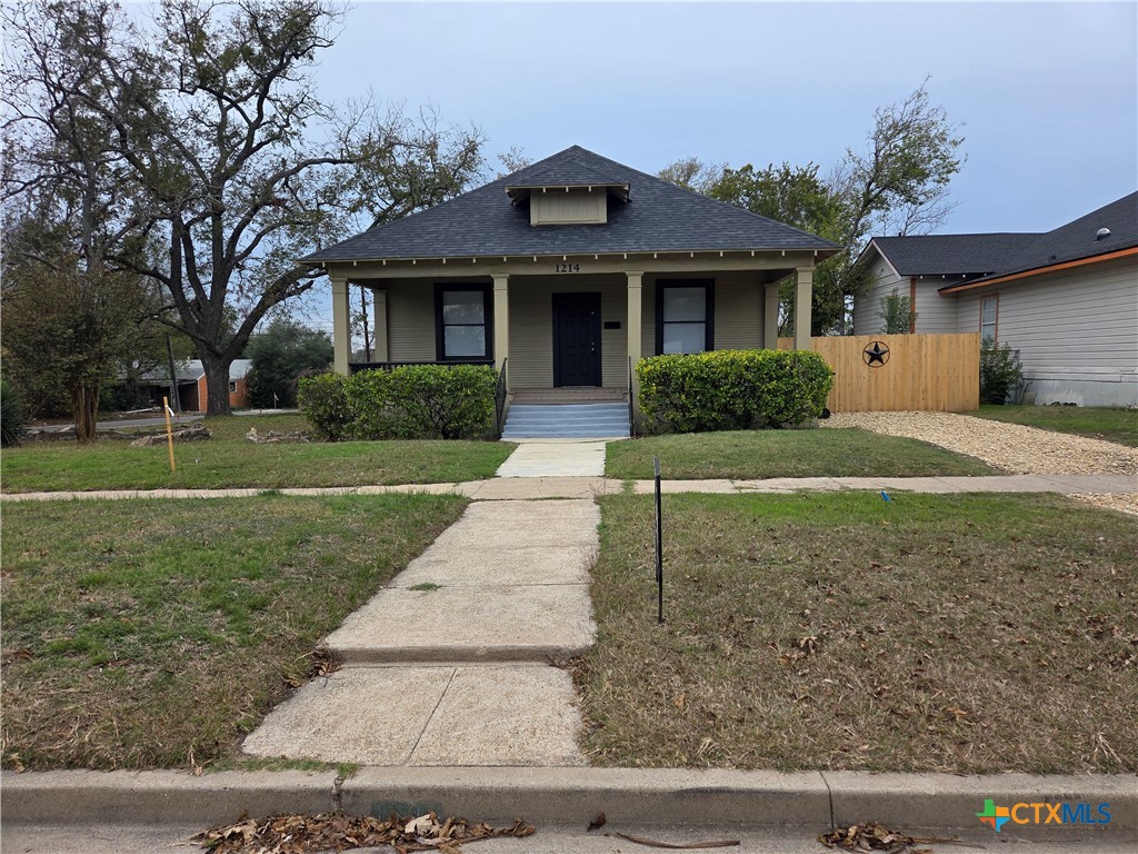 1214 South 11th Street Temple, TX 76504 - Photo 2 of 23 front view of a house next to a yard
