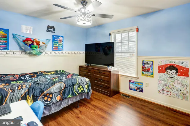 a room with toys and a wooden floor