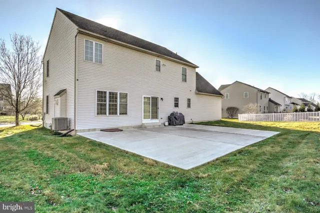 a view of a white building among the street