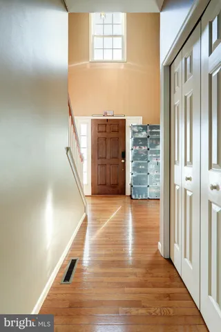 a view of a living room with wooden floor