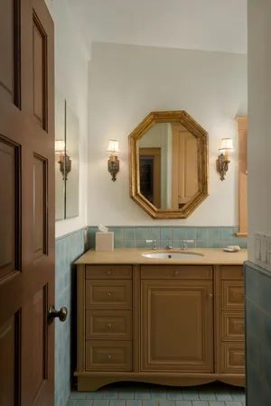 a bathroom with a sink and a mirror