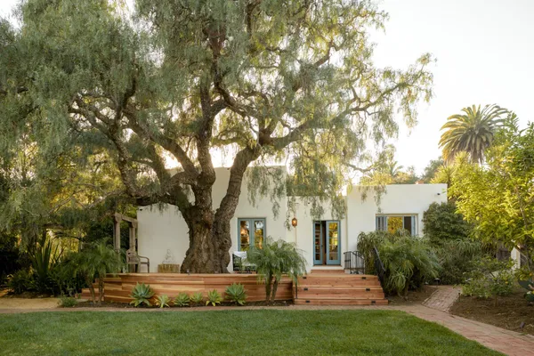 a front view of a house with garden