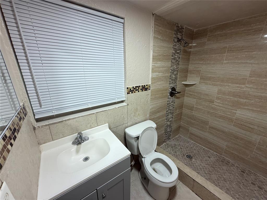 4570 Transport Road Bartow, FL 33830 - Photo 6 of 15 a bathroom with a sink toilet and shower
