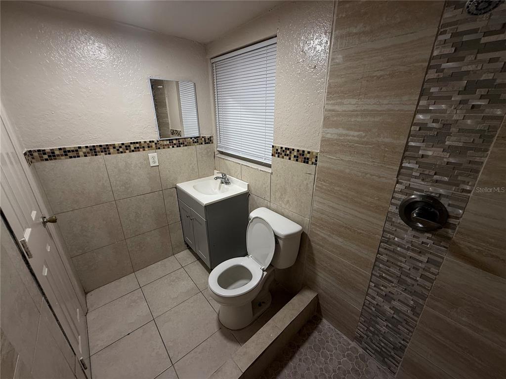 4570 Transport Road Bartow, FL 33830 - Photo 7 of 15 a bathroom with a toilet and a shower