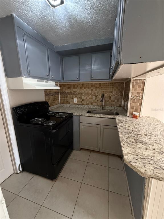4570 Transport Road Bartow, FL 33830 - Photo 8 of 15 a kitchen with a sink a stove top oven and cabinets
