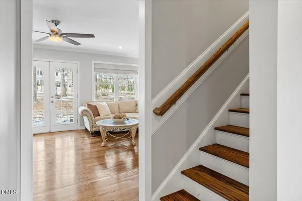 a living room with a fireplace and a flat screen tv