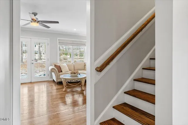 a bathroom with a shower a mirror and a sink