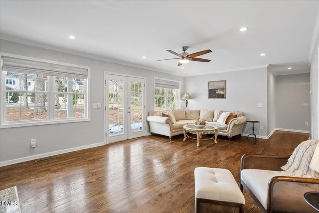 a bathroom with a granite countertop sink and a large window