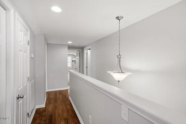 a view of a house with a yard covered in snow