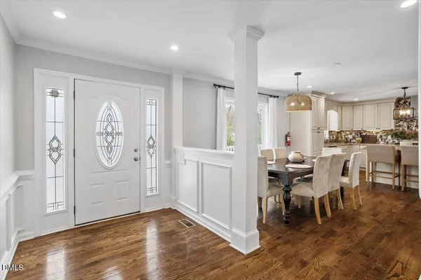 a view of a dining area with furniture window and wooden floor