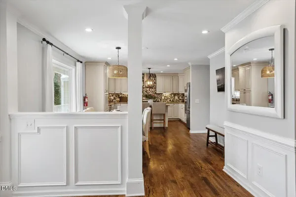 a view of kitchen with cabinets and wooden floor