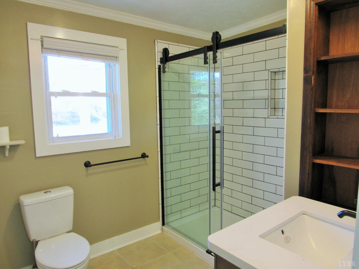 1697 South Amherst Highway Amherst, VA 24521 - Photo 15 of 45 a bathroom with a sink toilet and shower