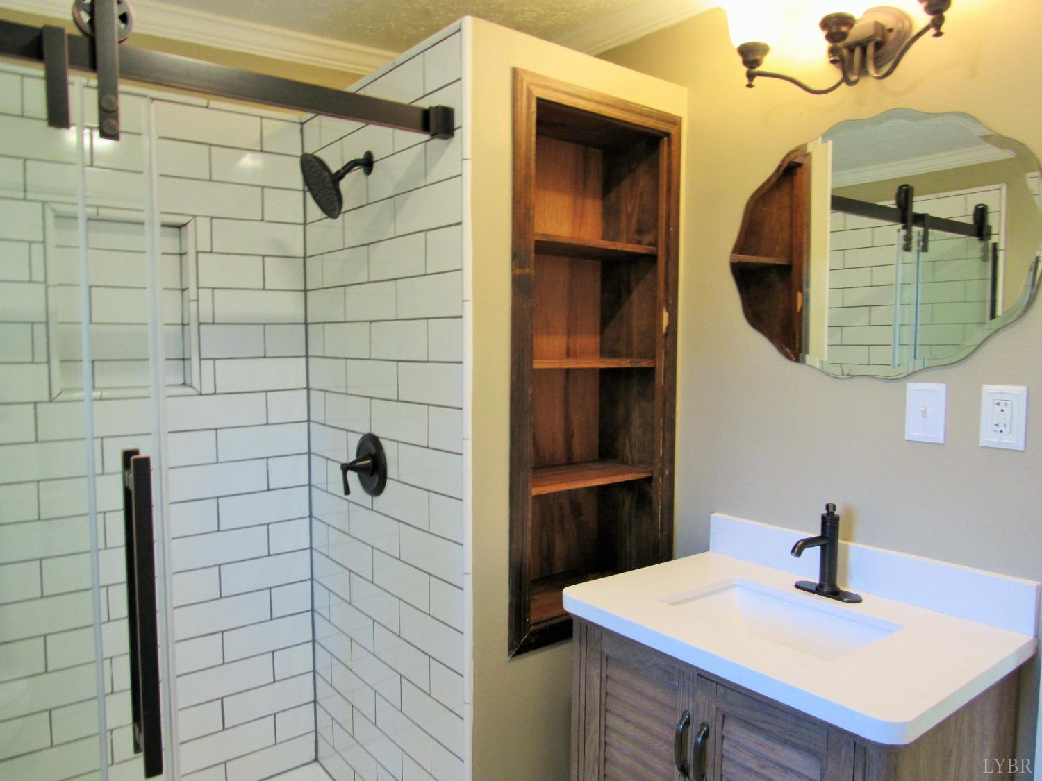 1697 South Amherst Highway Amherst, VA 24521 - Photo 16 of 45 a bathroom with a sink and a mirror