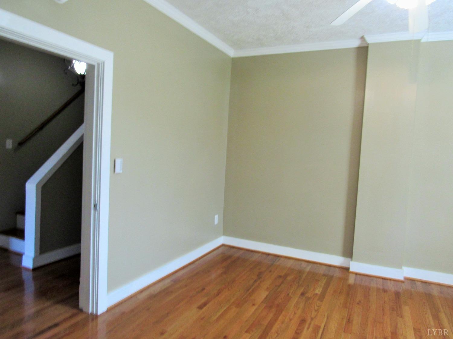 1697 South Amherst Highway Amherst, VA 24521 - Photo 17 of 45 a view of an empty room with wooden floor and closet