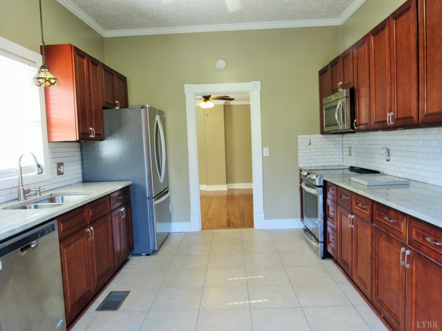 1697 South Amherst Highway Amherst, VA 24521 - Photo 20 of 45 a kitchen with stainless steel appliances granite countertop a sink stove and refrigerator