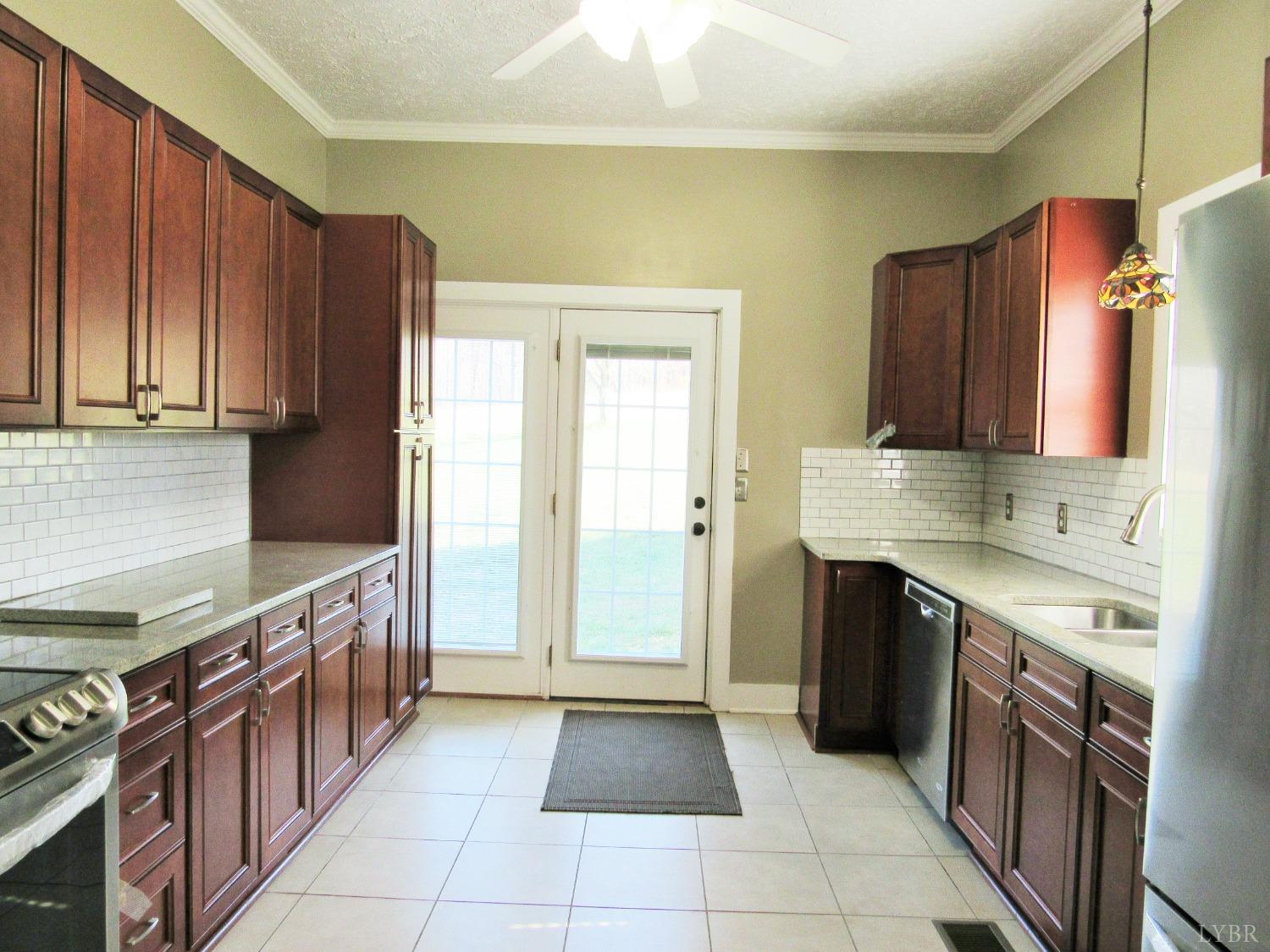 1697 South Amherst Highway Amherst, VA 24521 - Photo 21 of 45 a kitchen with stainless steel appliances granite countertop a stove and a refrigerator