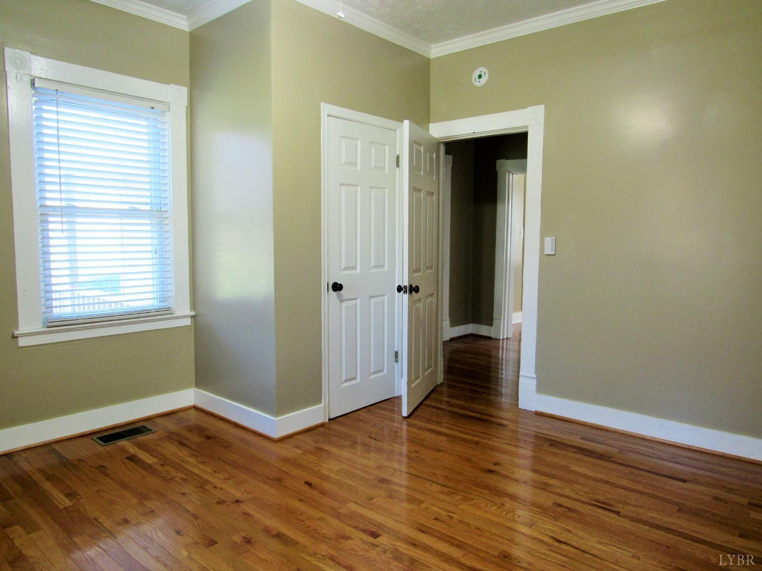 1697 South Amherst Highway Amherst, VA 24521 - Photo 23 of 45 a view of an empty room with wooden floor and a window