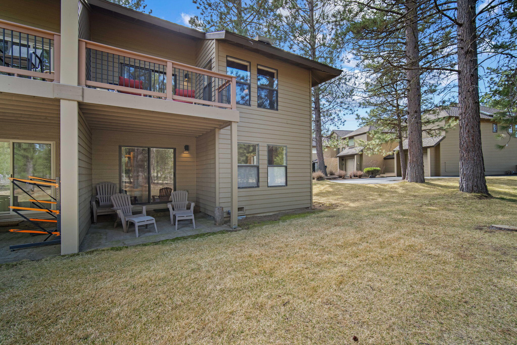 17682 Bittern Lane, Unit 31 Sunriver, OR 97707 - Photo 43 of 44 a view of a house with a patio and a yard