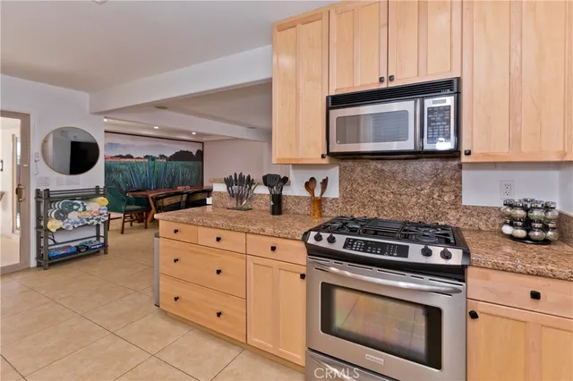 a kitchen with a sink stove and refrigerator