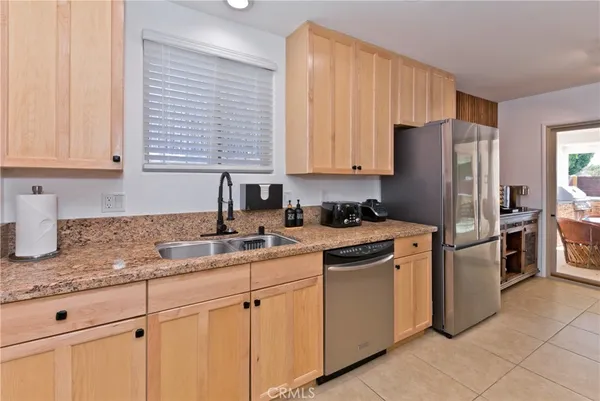a kitchen with a refrigerator and cabinet