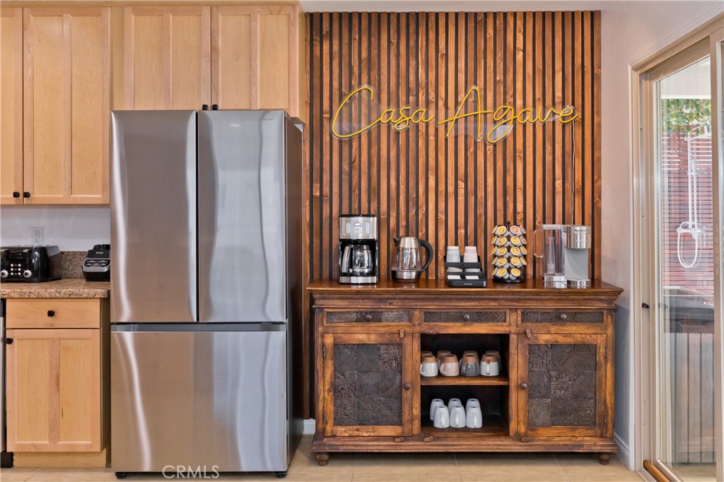10510 Ocotillo Road Desert Hot Springs, CA 92240 - Photo 15 of 35 a kitchen with a refrigerator and cabinet