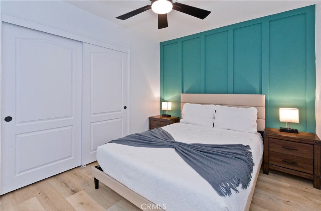 10510 Ocotillo Road Desert Hot Springs, CA 92240 - Photo 17 of 35 a bedroom with a bed and a chandelier