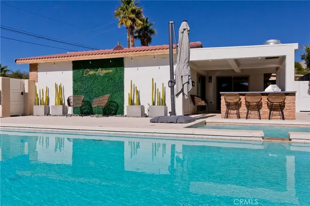 a view of a house with a swimming pool