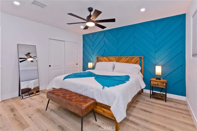 a bedroom with a bed and window