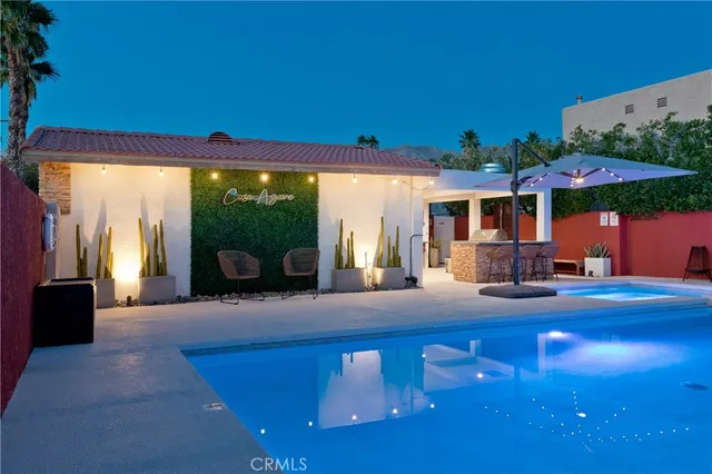 a view of living room with furniture and a floor to ceiling window