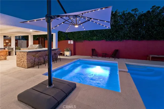a view of outdoor space with swimming pool and patio