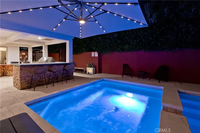 a view of a pool with a patio