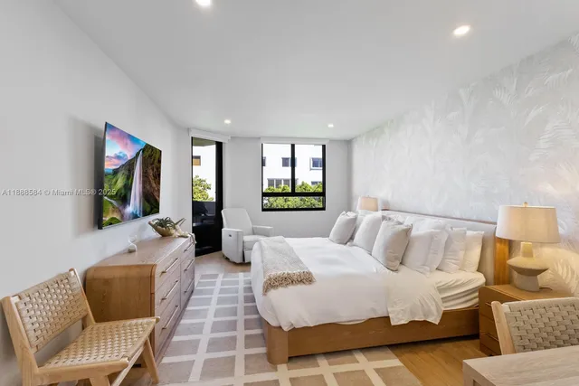 a bedroom with a bed and a couch