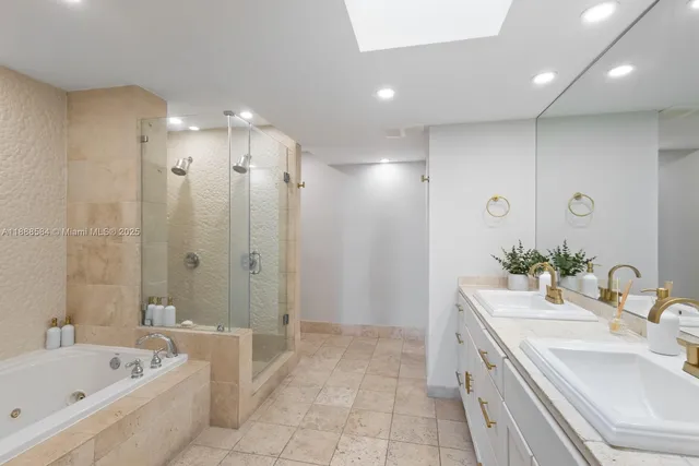 a spacious bathroom with a bathtub shower sink and mirror