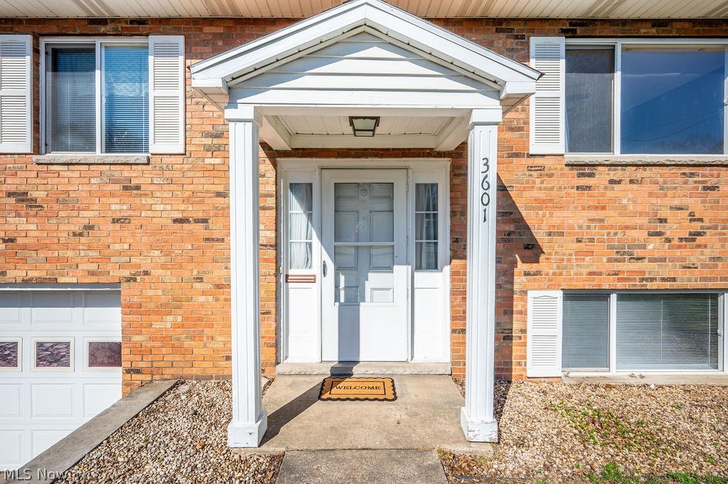 3601 River Road Vienna, WV 26105 - Photo 4 of 40 Doorway to property featuring brick siding