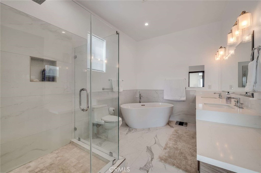 11837 Rideout Way Whittier, CA 90601 - Photo 24 of 44 a bathroom with a sink toilet and shower