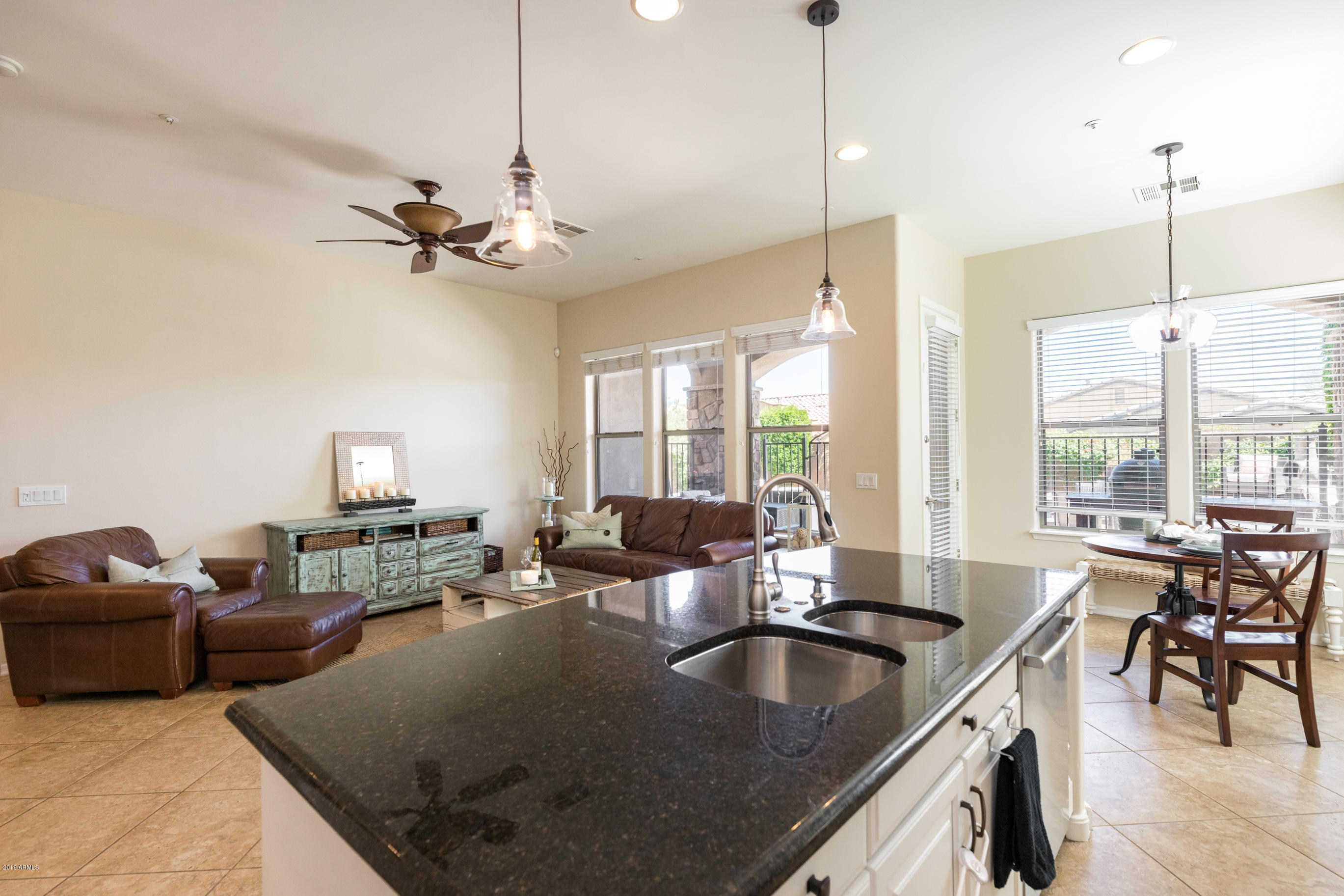 9185 East Canyon View Road Scottsdale, AZ 85255 - Photo 11 of 47 a living room with furniture kitchen view and a large window